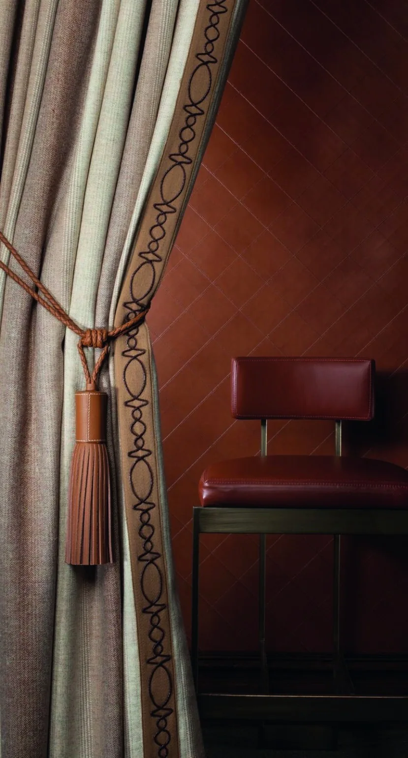 Curtain and chair details in a warm residential setting