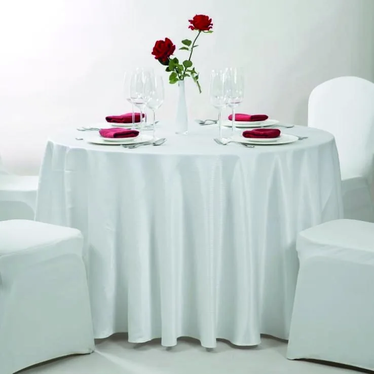 Tailored white table linen in a refined hospitality setting