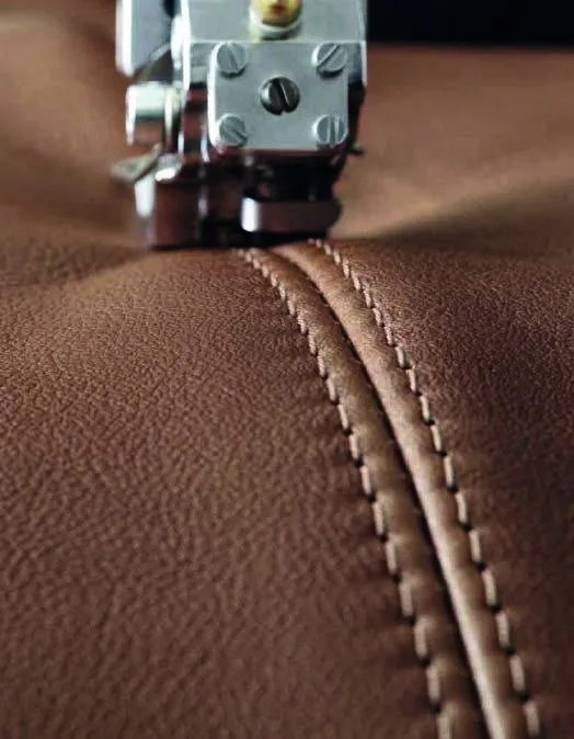 Close-up of precise stitching in warm brown upholstery
